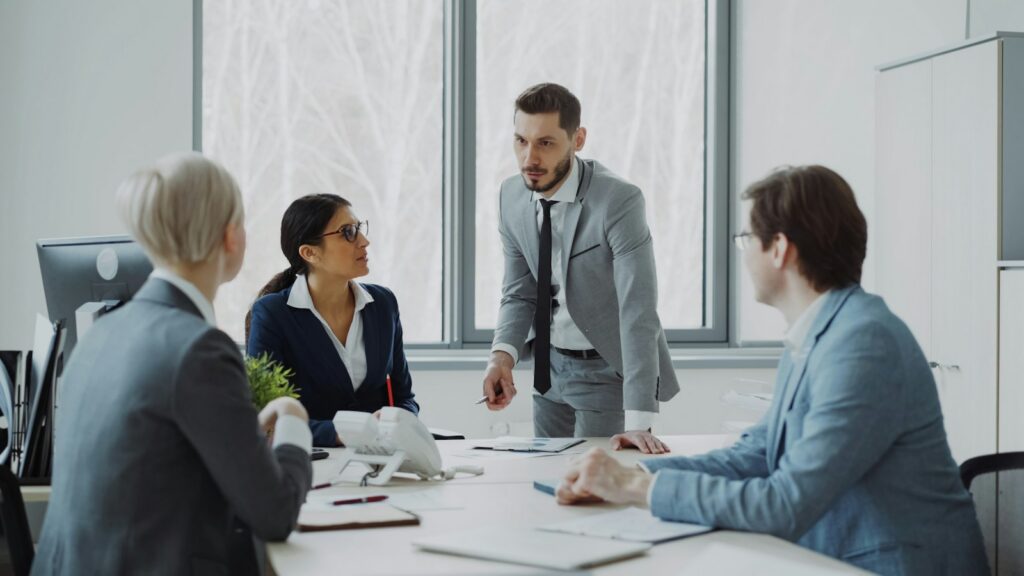 Executives discussing terms around a meeting table